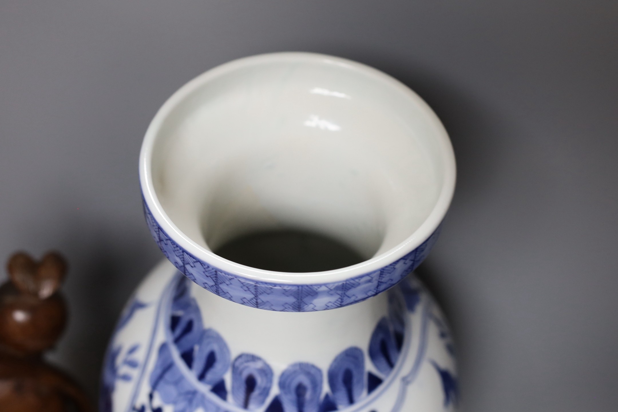 A large Chinese blue and white vase, 50cm tall, and a Chinese fisherman lamp